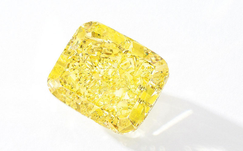 Man made cushion cut yellow diamonds